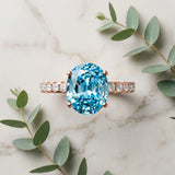 Rose gold Oval Cut Blue Topaz Solitaire Ring with Round  Pavé Band and Four-Prong Setting_57