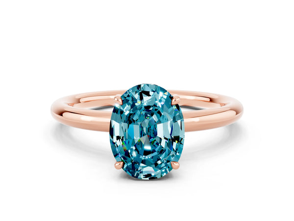 Rose gold Oval Cut Blue Topaz Solitaire Ring with Thin Band and Four-Prong Setting