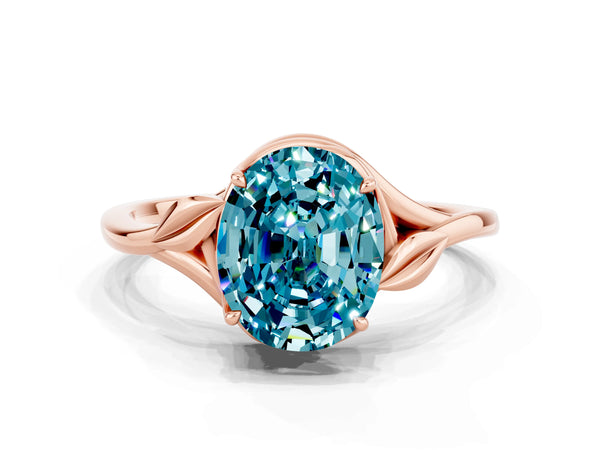 Rose gold Oval Cut Blue Topaz Solitaire Ring with Twist Band and Four-Prong Setting