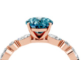 Rose gold Oval Cut Blue Topaz Solitaire with Side Stones on a Pavé Band and Four-Prong Setting_4