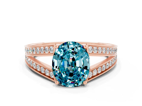 Rose gold Oval Cut Blue Topaz Split Shank Ring with Pavé Band and Four-Prong Setting
