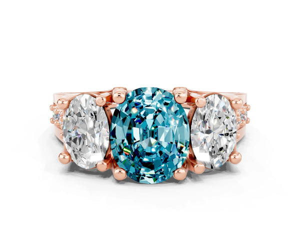 Rose gold Oval Cut Blue Topaz Three-Stone Ring with Channel Set Band and Four-Prong Setting