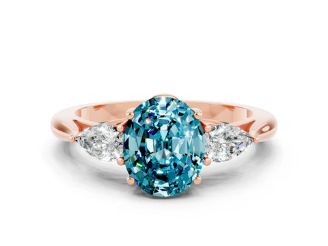 Rose gold Oval Cut Blue Topaz Three-Stone Ring with Pear Side Stones and Four-Prong Setting_12