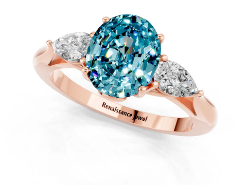 Rose gold Oval Cut Blue Topaz Three-Stone Ring with Pear Side Stones and Four-Prong Setting_13