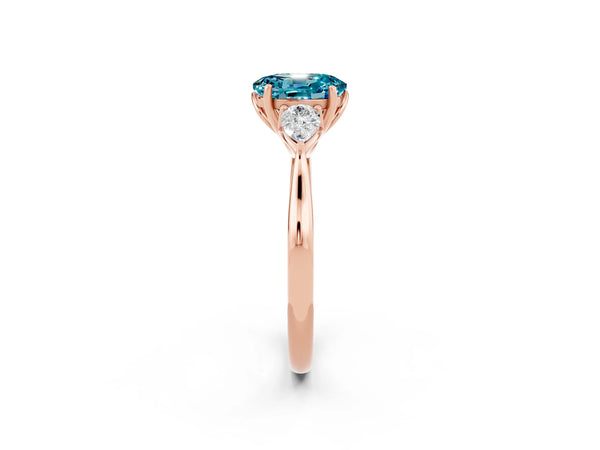 Rose gold Oval Cut Blue Topaz Three-Stone Ring with Pear  Side Stones and Prong Setting