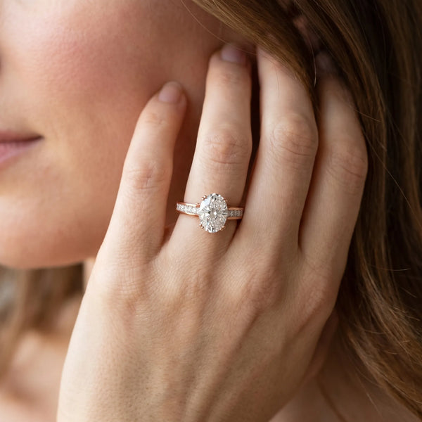Rose gold Oval Cut Channel Set Solitaire Engagement Ring with Prong Setting