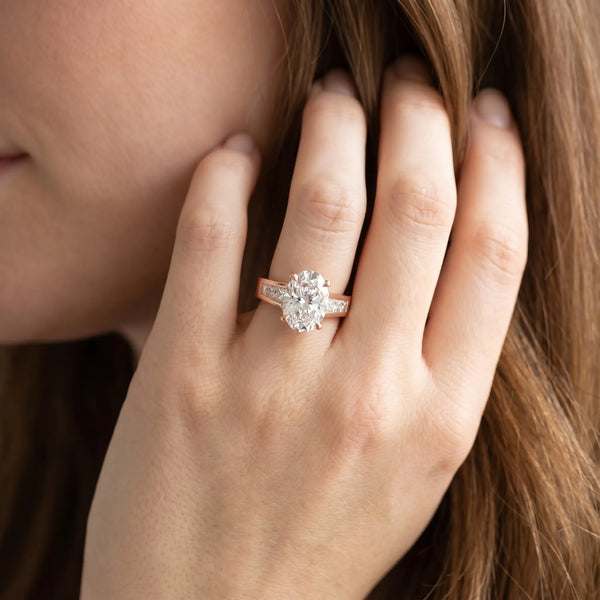 Rose gold Oval Cut Channel Set Solitaire Ring with Four-Prong Setting