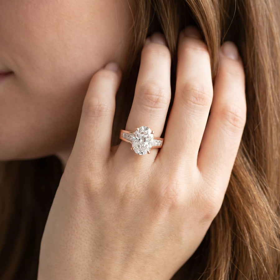 Rose gold Oval Cut Channel Set Solitaire Ring with Four-Prong Setting