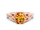 Rose gold Oval Cut Citrine Solitaire Engagement Ring with Celtic Knot Band and Four-Prong Setting