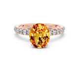 Rose gold Oval Cut Citrine Solitaire Ring with Pavé Accents and Four-Prong Setting