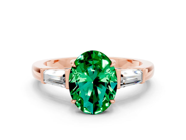 Rose gold Oval Cut Emerald Three-Stone Ring with Tapered Baguette Side Stones and Prong Setting