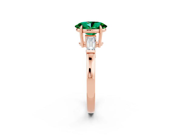 Rose gold Oval Cut Emerald Three-Stone Ring with Tapered Baguette Side Stones and Prong Setting