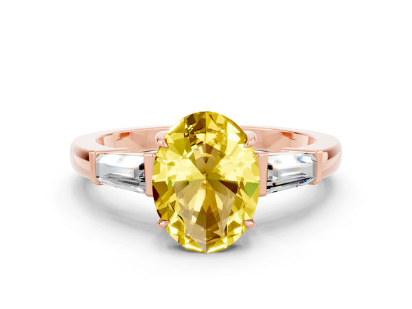 Rose gold Oval Cut Yellow Sapphire Three-Stone Ring with Tapered Baguette Side Stones and Prong Setting