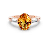 Rose gold Oval Cut Cut Diamond Ring with Tapered Baguette Side Stones in Four-Prong Setting