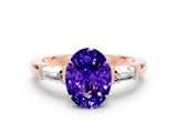 Rose gold Oval Cut Cut Diamond Ring with Tapered Baguette Side Stones in Four-Prong Setting