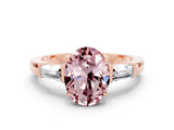 Rose gold Oval Cut Cut Diamond Ring with Tapered Baguette Side Stones in Four-Prong Setting