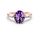 Rose gold Oval Cut Cut Diamond Ring with Tapered Baguette Side Stones in Four-Prong Setting
