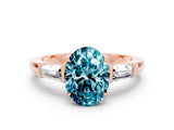 Rose gold Oval Cut Cut Diamond Ring with Tapered Baguette Side Stones in Four-Prong Setting
