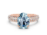 Rose gold Oval Cut Cut Pave Diamond Engagement Ring with Channel Set Band and Four-Prong Setting