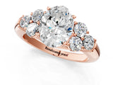 Rose gold Oval Cut Diamond Cluster Ring with Round Accent Stones and Prong Setting on a Classic Band_63