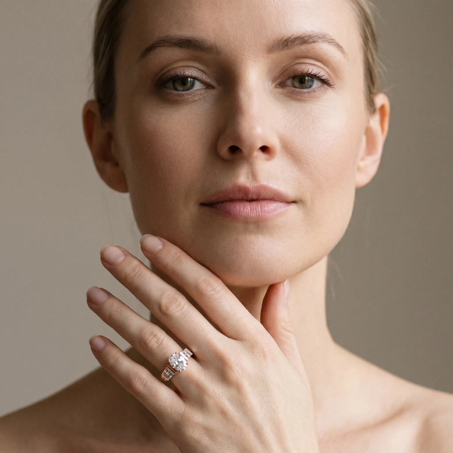 Rose gold Oval Cut Diamond Engagement Ring with Baguette Side Stones and Channel Set Band