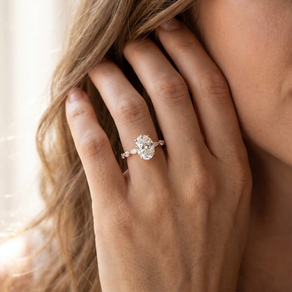 Rose gold Oval Cut Diamond Ring with Marquise Side Stones and Prong Setting