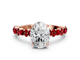 Rose gold Oval Cut Diamond Side Stone Solitaire Ring with Round with Ruby side stone and Four-Prong Setting