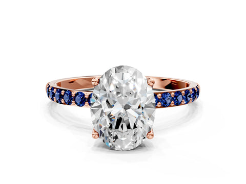 Rose gold Oval Cut Diamond Solitaire Engagement Ring with Round with Blue Sapphire side stone Pavé Band and Prong Setting