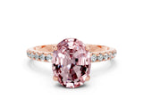 Rose gold Oval Cut Diamond Solitaire Ring with Four-Prong Setting and Pavé Band