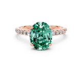 Rose gold Oval Cut Diamond Solitaire Ring with Four-Prong Setting and Pavé Band