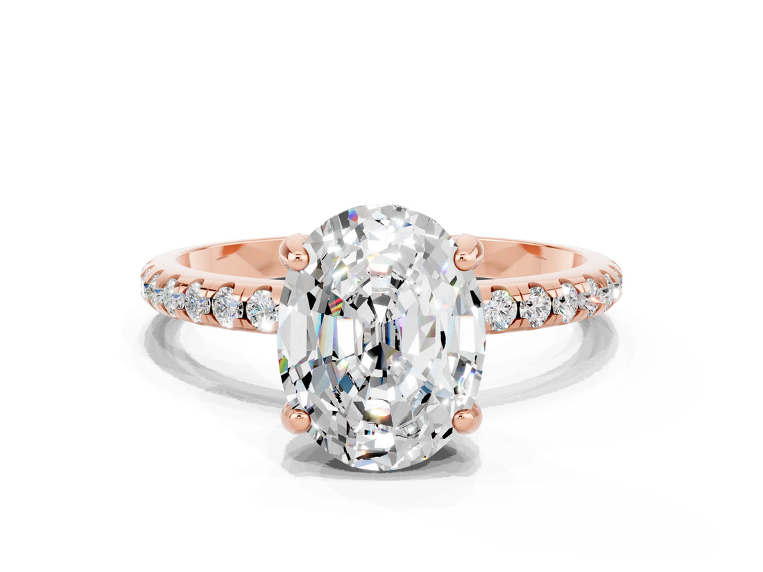 Rose gold Oval Cut Diamond Solitaire Ring with Four-Prong Setting and Pavé Band