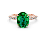 Rose gold Oval Cut Diamond Solitaire Ring with Four-Prong Setting and Pavé Band