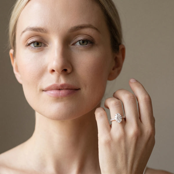 Rose gold Oval Cut Diamond Solitaire Ring with Micro Pave Band and Four Prong Setting
