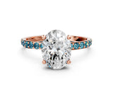 Rose gold Oval Cut Diamond Solitaire Ring with Round with Blue Topaz side stone Pavé Band and Prong Setting_12