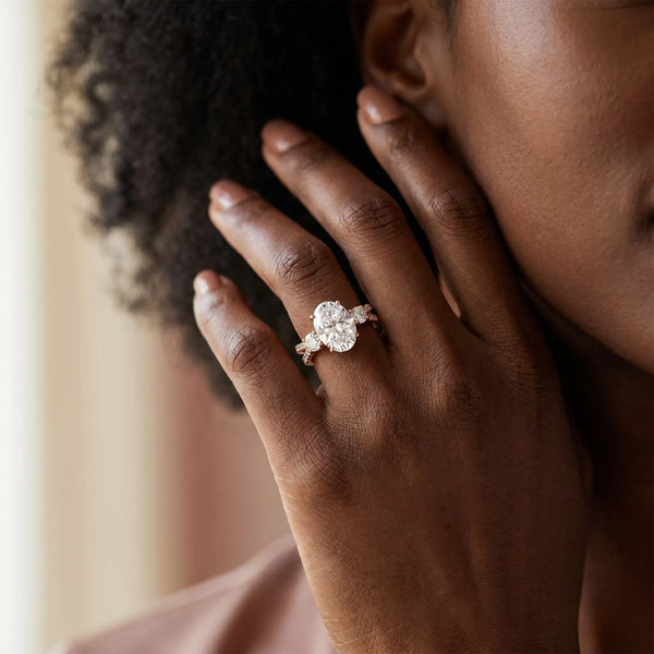 Rose gold Oval Cut Diamond Three-Stone Ring with Pavé Split Shank and Four-Prong Setting