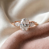 Rose gold Oval Cut Diamond Three-Stone Ring with Pear  Side Stones and Prong Setting_104