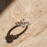 Rose gold Oval Cut Diamond Three-Stone Ring with Round Side Stones and Pavé Band_105