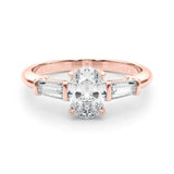 Rose gold Oval Cut Diamond Three-Stone Ring with Tapered Baguette Side Stones and Prong Setting 1