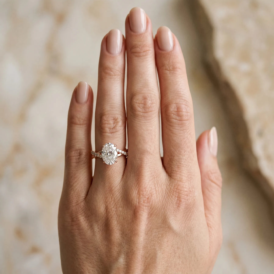 Rose gold Oval Cut Diamond Twisted Band with Pavé Setting and Four-Prong Setting