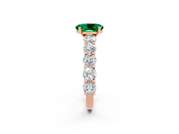Rose gold Oval Cut Emerald Prong Setting with Side Stones on a Pave Band