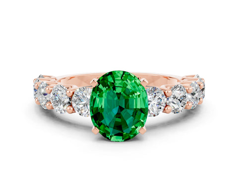 Rose gold Oval Cut Emerald Prong Setting with Side Stones on a Pave Band