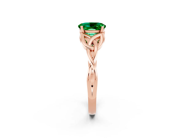 Rose gold Oval Cut Emerald Solitaire Engagement Ring with Celtic Knot Band and Four-Prong Setting