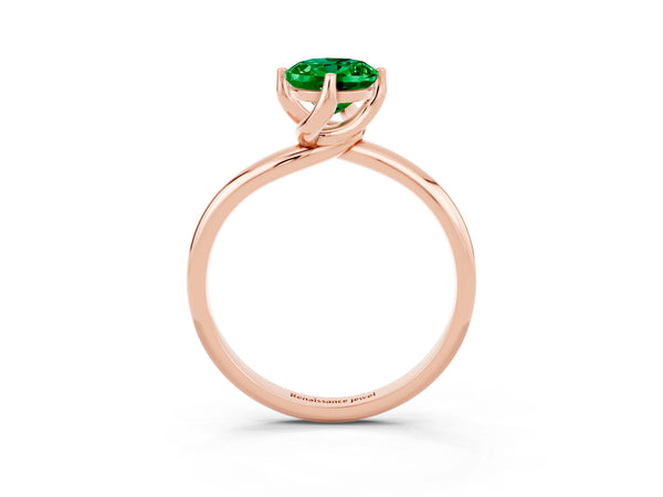 Rose gold Oval Cut Emerald Solitaire Engagement Ring with Four-Prong Setting and Classic Band