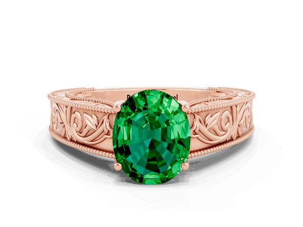 Rose gold Oval Cut Emerald Solitaire Ring with Engraved Band and Four-Prong Setting