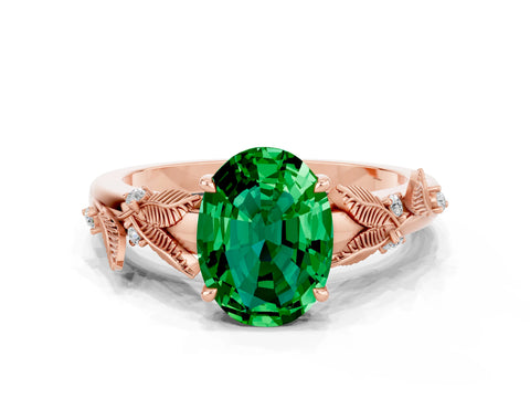 Rose gold Oval Cut Emerald Solitaire Ring with Leaf Motif Band and Four-Prong Setting