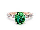 Rose gold Oval Cut Emerald Solitaire Ring with Pavé Accents and Four-Prong Setting