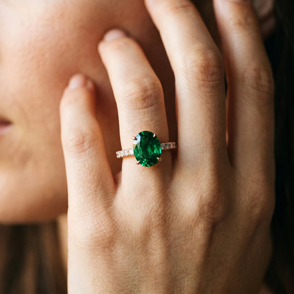 Rose gold Oval Cut Emerald Solitaire Ring with Round  Pavé Band and Four-Prong Setting