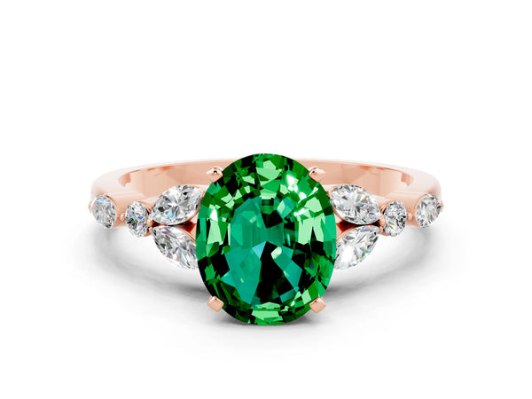 Rose gold Oval Cut Emerald Solitaire Ring with Side Stones and Four-Prong Setting