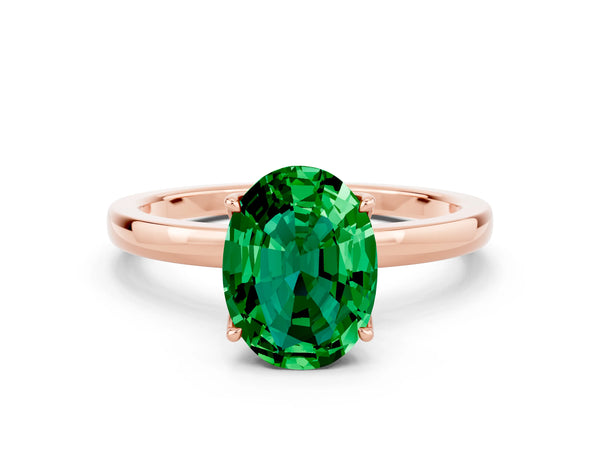 Rose gold Oval Cut Emerald Solitaire Ring with Thin Band and Prong Setting