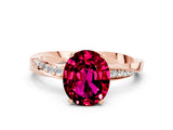 Rose gold Oval Cut Garnet Engagement Ring with Side Stone Accents and Four-Prong Setting_27